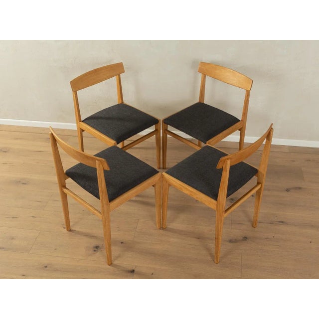 Classic Scandinavian-style dining chairs from the 1960s. Solid ash frame. The chairs have been reupholstered and covered...