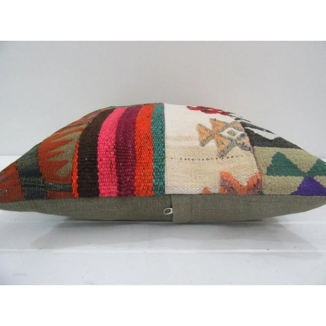 This is a pillow cover made from a vintage kilim rug. The piece was properly washed and ready to use. Pillow inserts not...