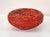 A large vintage Chinese red cinnabar box with deep relief carved lid depicting peonies, trees and a landscape with a...