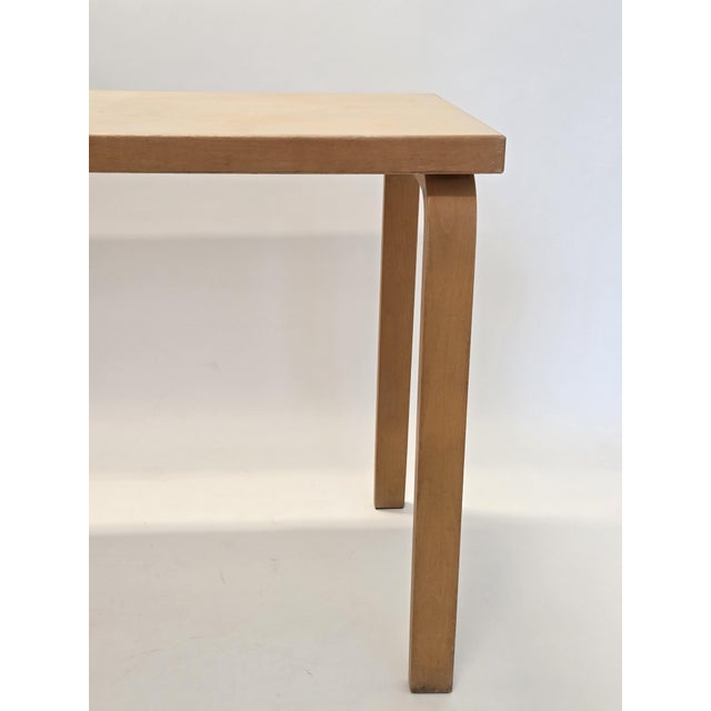 Artek table, birch with cream linoleum. The table is from around the 1950s. Wear consistent with age. Designer Alvar...