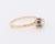 A timeless vintage solitaire ring from the 1970s, crafted in 18K yellow gold (750/1000) and platinum. The centerpiece is a...