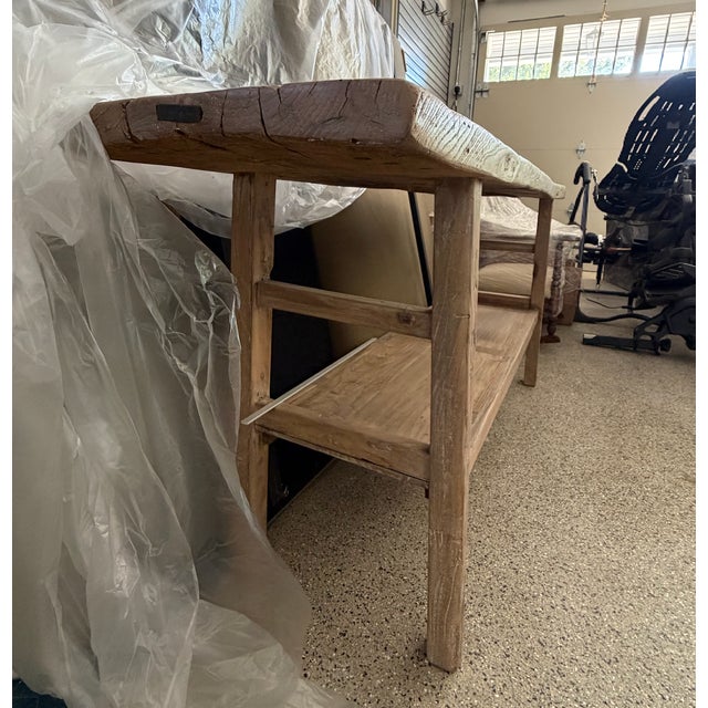 Solid reclaimed elm console table with a naturally bleached, weathered finish. The thick plank top retains its original...