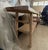 Solid reclaimed elm console table with a naturally bleached, weathered finish. The thick plank top retains its original...