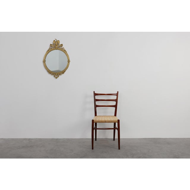 This elegant mirror exemplifies the refined grandeur of Neo‑Classical design. Crafted in France during the early 20th...