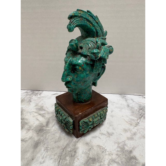 Vintage Midcentury Mayan or Aztec warrior sculptural head made of crushed turquoise and malachite stone on a wood base....