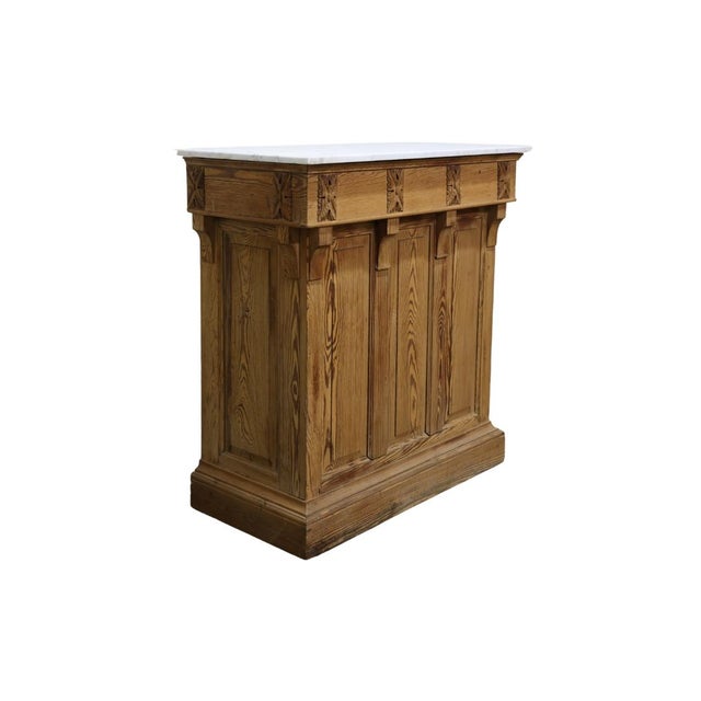 This elegant 1900s French wooden bar with a marble top exudes timeless sophistication and craftsmanship. The intricate...