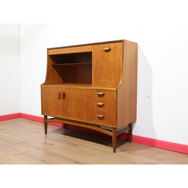 Introducing thid Mid Century Modern Teak Brasilia Short SidebTall oard Credenza Buffet by G Plan, a stunning piece from...