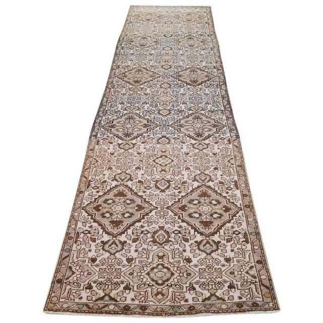 Hand-knotted with care using traditional rug-making techniques, this wool rug blends timeless craftsmanship with a modern...