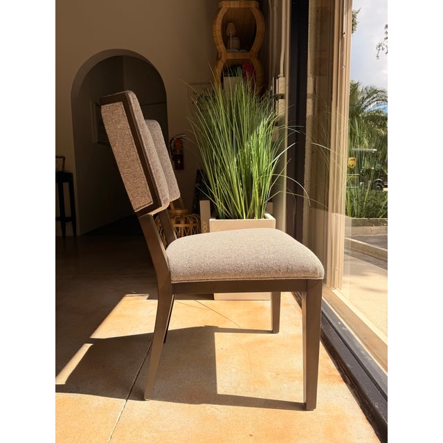 Contemporary upholstered dining chair featuring a clean, tailored silhouette. An updated classic design detail the gently...