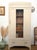 This stunning French armoire is a masterclass in blending the geometric elegance of the Art Deco period with the rustic...