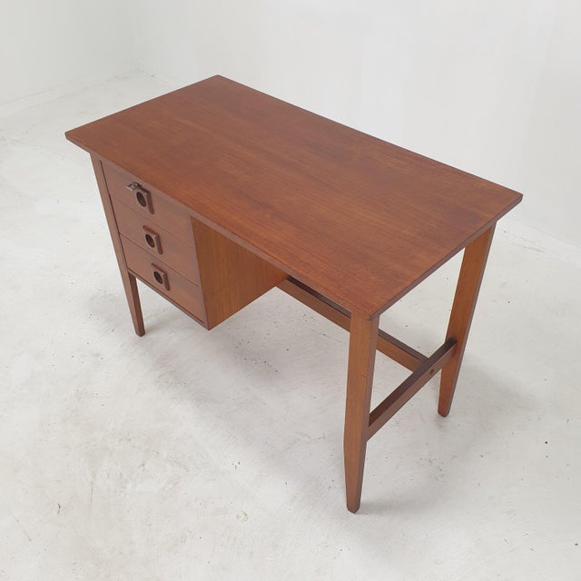 Very nice teak desk, produced in Denmark in the 1970s. The desk can be used as free standing thanks to the finished back...