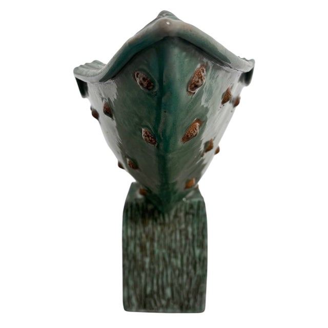 25”W x 12 1/2”H x 7 1/4”D This substantial ceramic vessel represents a stunning dialogue between Mid-Century Modernist...