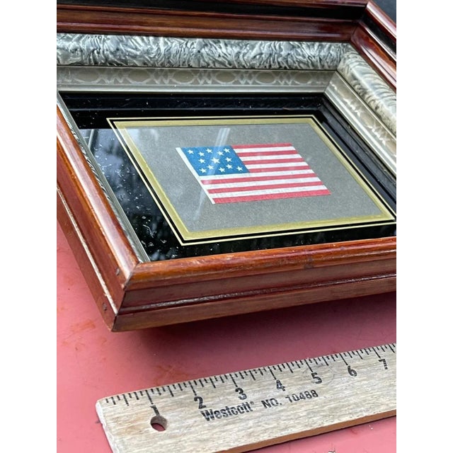 Very very desirable parade flag in a perfectly suited antique gilt frame with original class. Circa 1876. Rare. This it...