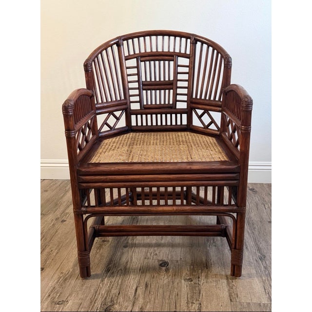 A striking vintage Brighton Pavilion–style accent chair with an intricate bamboo-inspired frame, decorative fretwork, and...