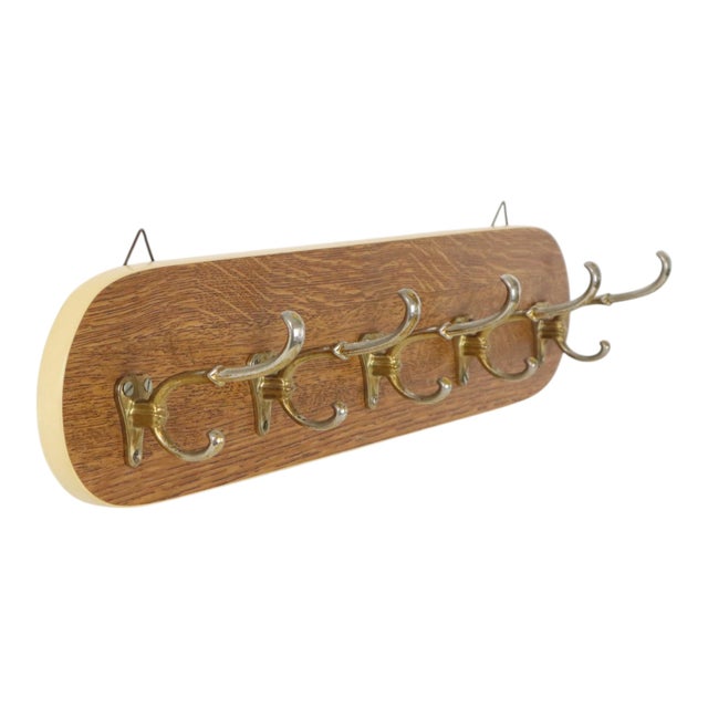 Cool vintage wall-mounted coat rack with 5 hooks, featuring a classic 1950s Rockabilly style; it consists of a rounded...