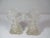 Vintage pair of Art Deco clear crystal perfume bottles. The ornate bottles have a layered step pattern on the sides with a...