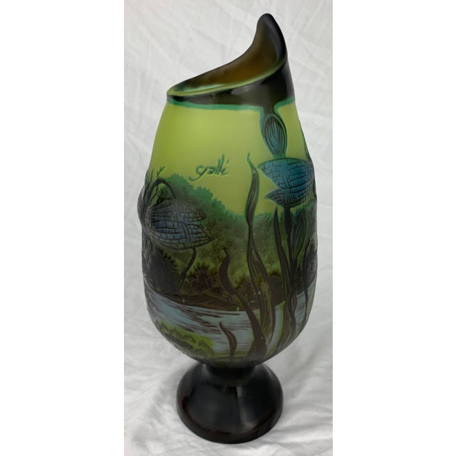 Large Art Nouveau Cameo Vase by Emile Galle decorated with flowers, dragonfly and frogs. The vase design is embossed with...