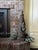 Val's Dollhouse is proud to present a tall hand carved wooden Santa holding a basket and toys. His jacket is carved in a...