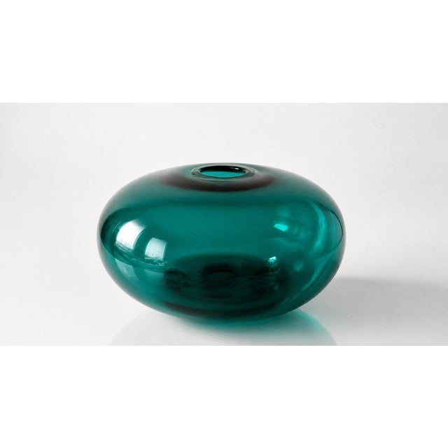 Striking and sculptural “Donut” vase from IKEA’s iconic Stockholm collection, executed in rich emerald green art glass....