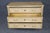 An exceptionally elegant pair of English-made commodes in the French Louis XVI style, beautifully crafted in cerused oak...