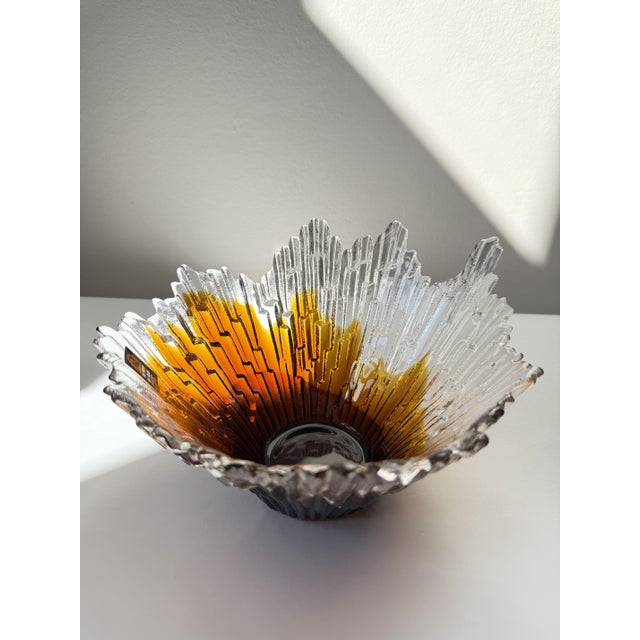 A "Revontuli" bowl - the name is Finnish for "northern lights" — designed by Tauno Wirkkala for Humppila Glassworks in the...