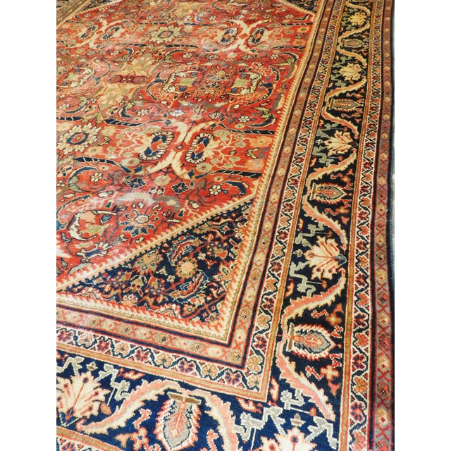 An attractive authentic hand knotted antique Persian rug. Rich in tone. 100% pure new wool on cotton foundation. 10'3"x 14'