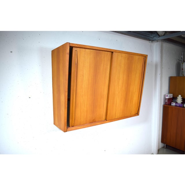 This is a beautifully designed wall-mounted cabinet from the 1950s by Monke Möbel. Made in Germany by Friedrich Mark &...