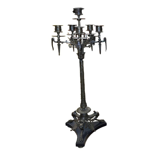 A dramatic and finely cast pair of late 19th century French bronze candelabras, executed in rich dark patinated bronze and...