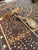 Two hand carved horn decorative spoons. Each spoon handle has a distinctive design and each spoon shows natural varying...