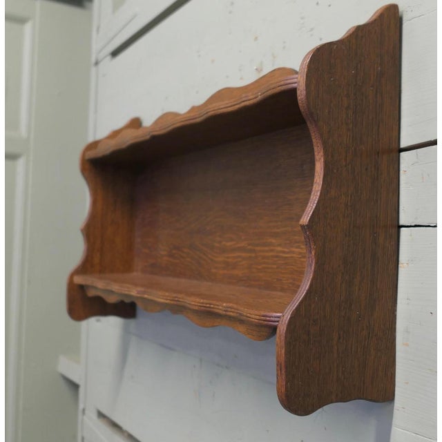 Arts and Crafts Open Front Wall Hanging Bookshelf The unit has 2 open shelves and has scalloped and reeded decoration at...