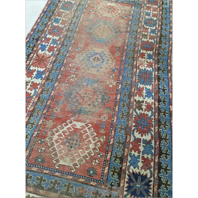 Antique hand-knotted 100% pure wool pile on wool foundation gallery rug featuring a terracotta field with geometric...