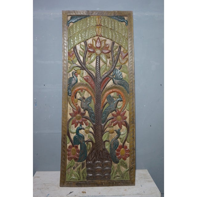 A striking vintage carved wooden door panel showcasing the timeless Tree of Life motif, hand-painted in rich, soulful hues...