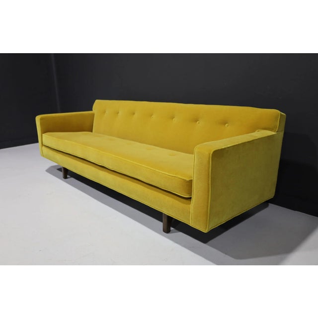 Beautifully updated and restored, the iconic bracket back sofa by Edward Wormley for Dunbar is a must-have for any mid-...