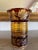 This striking 8 inch vase is a classic example of Bohemian craftsmanship. It features an intricately etched floral motif...