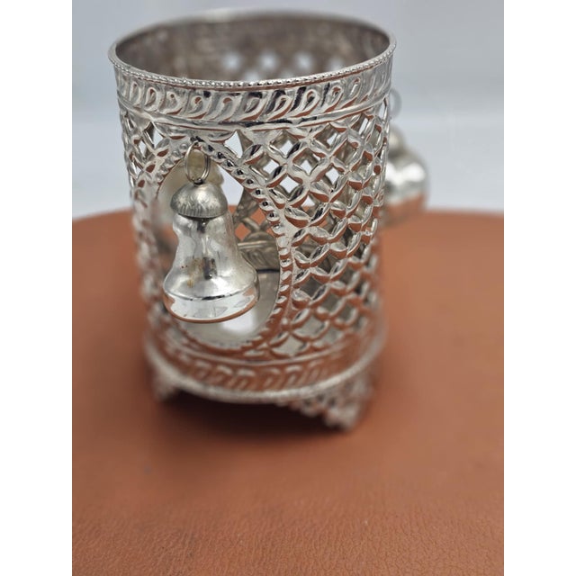 Openwork plated base for a candle or bottle holder, 1970s, dimensions: height 13 cm, diameter 8.8 cm.