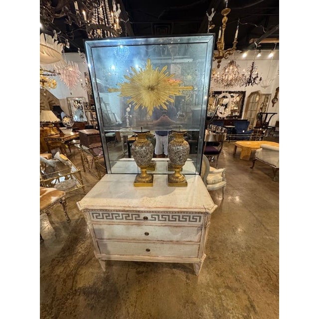 This product is a pair of antique 19th-century French marble and bronze urns, adding a touch of elegance and history to...