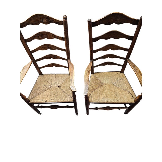 Matched Pair Of Antique Eighteenth-Century English Ladderback Rush Seat Chairs This exquisite pair of authentic late...