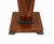 A superb pair of Art Deco style pedestal stands veneered in richly figured macassar ebony Each pedestal features a...