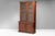 Two door bookcase with glazed arched top doors on cupboard base in mahogany (replaced cornice). U.K circa 1830.