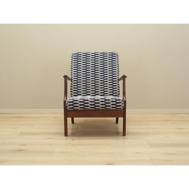 The armchair was made in the 1970s, Danish production. The legs are made of solid beech wood. The armchair has been...