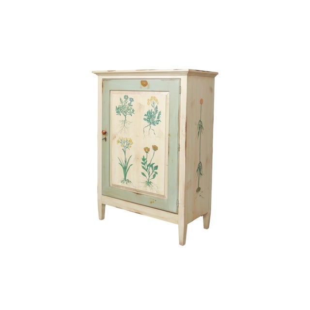 A Jim Peed for Romweber botanical painted "Flora" style cabinet. Made of knotty pine, with flowers depicted on the sides...