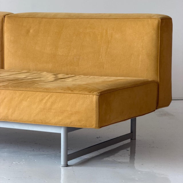 c. 1990s. Italy. Yellow alcantara fabric with metal base. One side turns into backrest. This piece is attributed to the...