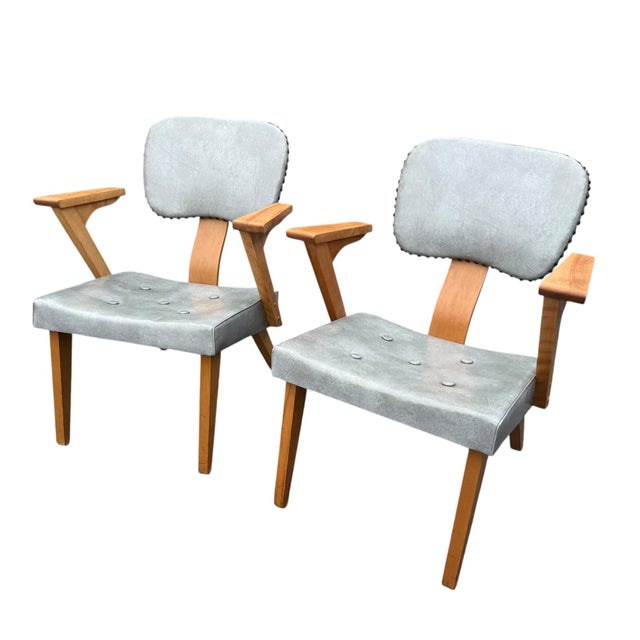 A striking pair of American mid-century modern armchairs made by the Custom & Modern Upholstering Co. of Gardner,...