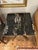 Stunning pair of French deco marble top end tables having rich black marble tops with camel and cream grain, with elegant...