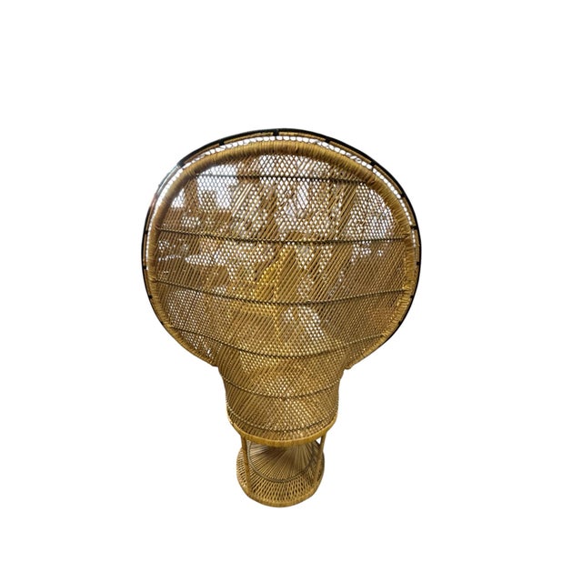 Vintage peacock-style wicker chair likely from the Boho revival era between 1960 and 1980, featuring a dramatic fan-shaped...