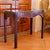 A sleek game table that can double as a small console table or side table. The contours are unusually dramatic, with...