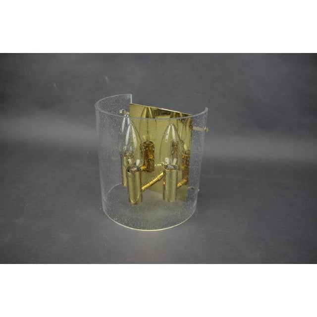 Elegant wall lamp produced in Europe during the 1970s, most likely in Germany. This refined Mid-Century Modern wall lamp...