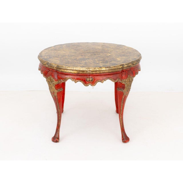 Louis XV Style Gilded Faux Marble Circular Center Table, with red painted cabriole legs on claw and ball feet. 30" H x...