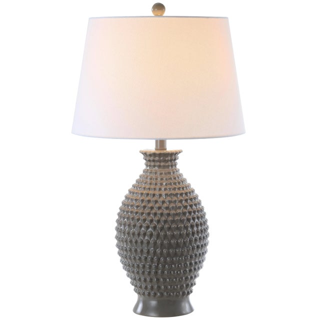 Bring a instant artistic edge to any interior with this contemporary table lamp. it's bold grey design adds depth and...