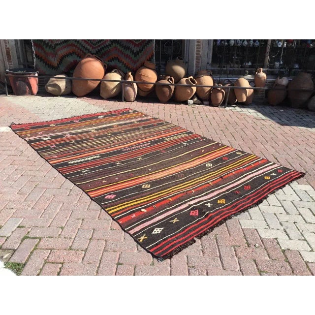 This beautiful, vintage, handwoven kilim is approximately 60 years old. It is handmade, of very fine quality hand spun...